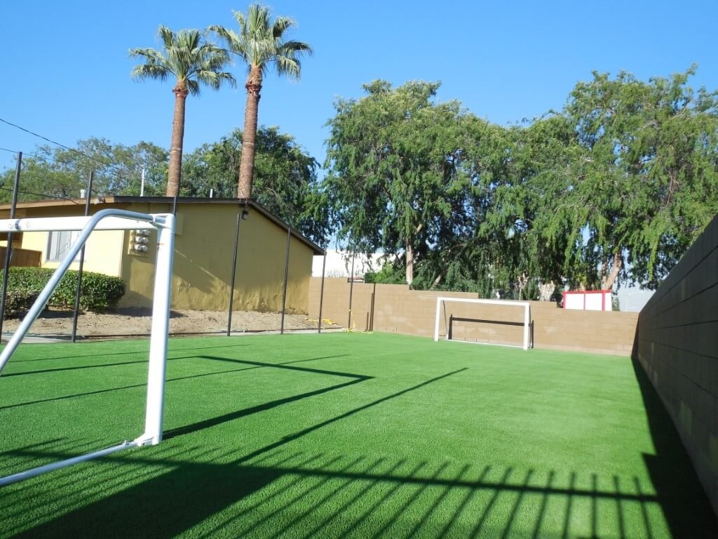 Artificial turf made to play sports. In the image there's a soccer field.