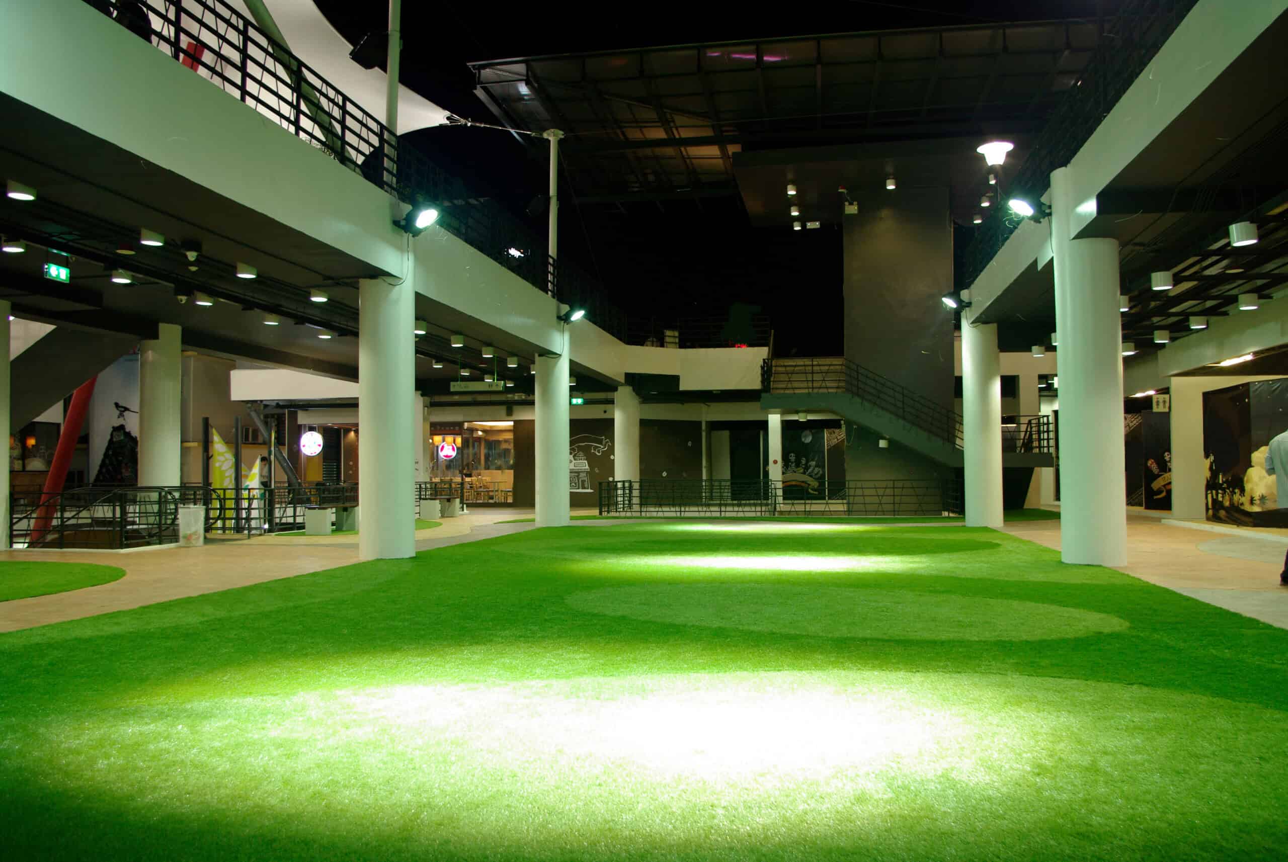 Indoor Synthetic Turf for Events Indoor synthetic turf installation in a spacious event venue.
